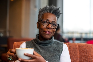 Black woman drinking coffee