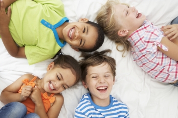 kids playing on bed