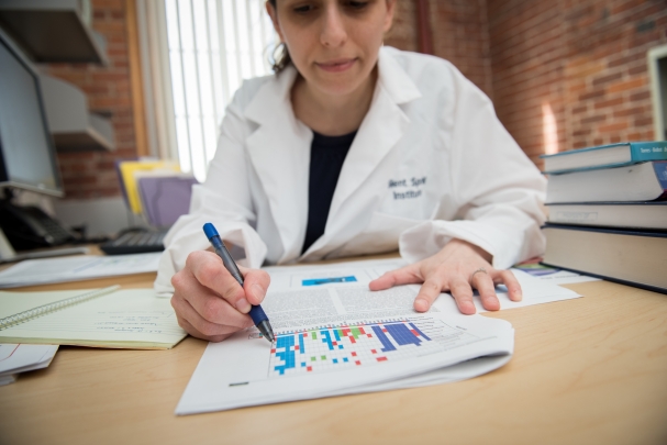 Scientist working at her office desk.