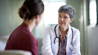 female doctor talking to patient