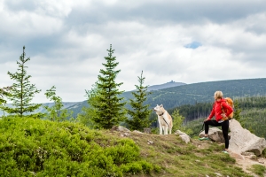 woman hiking with dog