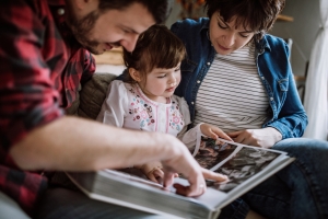 family looking at photo album