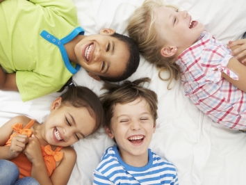 kids playing on bed