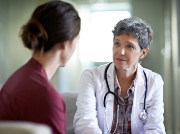 female doctor talking to patient