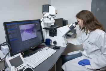 scientist at the microscope